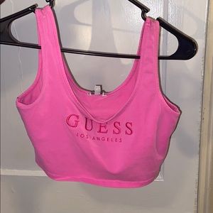 A pink GUESS crop top